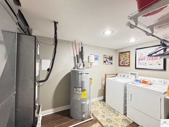 711 Katy Cir, Sedalia, MO 65301 - laundry room featuring independent washer and dryer, electric water heater, baseboards, and recessed lighting