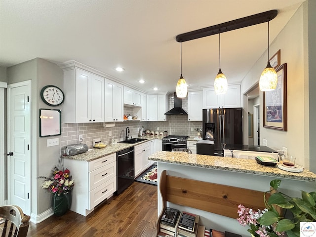 711 Katy Cir, Sedalia, MO 65301 - kitchen with wall chimney range hood, dishwasher, fridge with ice dispenser, gas stove, and a sink
