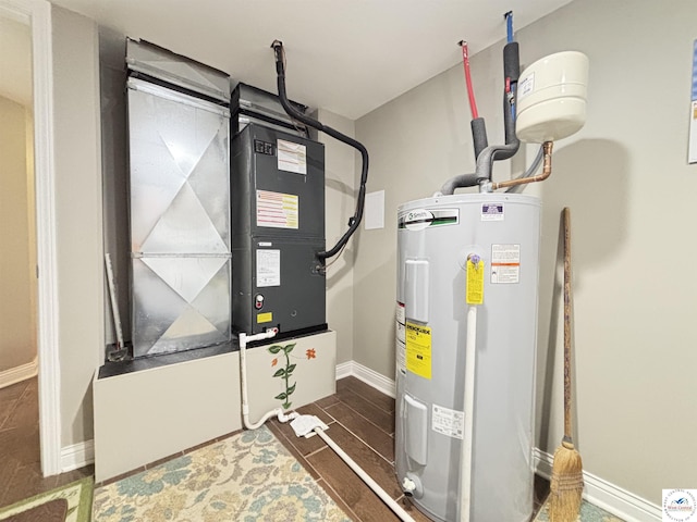 711 Katy Cir, Sedalia, MO 65301 - utility room with electric water heater and heating unit