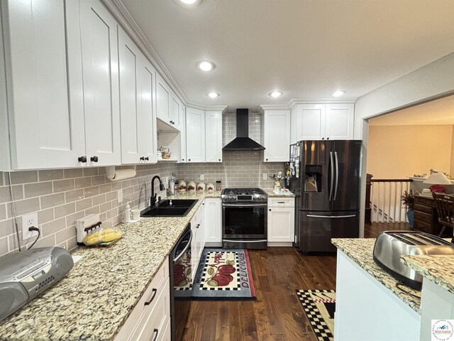 711 Katy Cir, Sedalia, MO 65301 - kitchen with stainless steel range with gas cooktop, wall chimney exhaust hood, refrigerator with ice dispenser, a sink, and black dishwasher