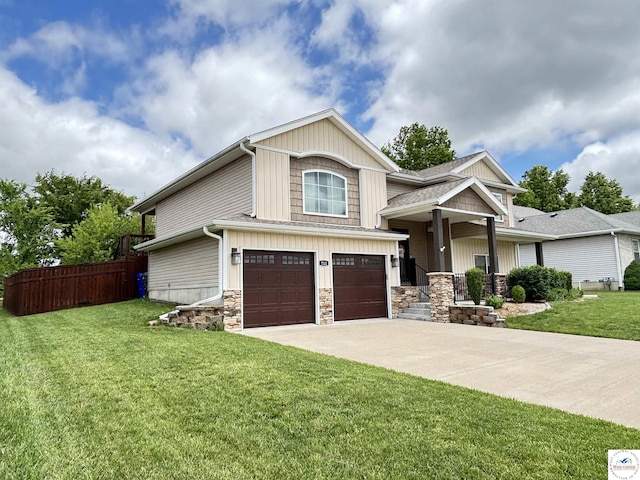 711 Katy Cir, Sedalia, MO 65301 - craftsman-style home featuring an attached garage, stone siding, and driveway