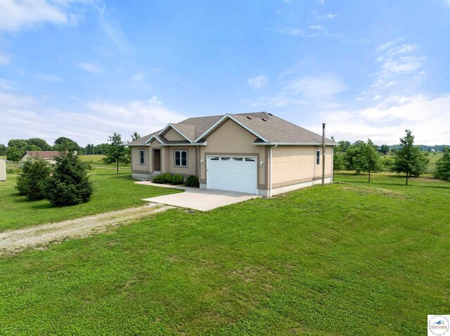29854 Griessen Rd, Smithton, MO 65350 - ranch-style home featuring driveway, a garage, stucco siding, and a front yard