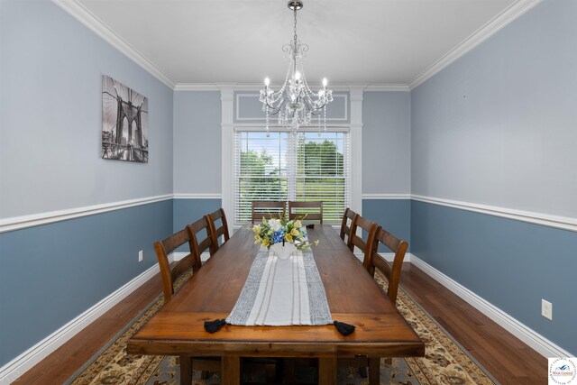 29854 Griessen Rd, Smithton, MO 65350 - dining space featuring a chandelier, wood finished floors, crown molding, baseboards, and decorative columns