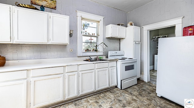28302 S D State Rte, Cleveland, MO 64734 - kitchen featuring white cabinets, white appliances, light countertops, and a sink