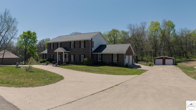 1679 Sunchase Dr, Warsaw, MO 65355 - colonial-style house with concrete driveway, brick siding, and a front yard