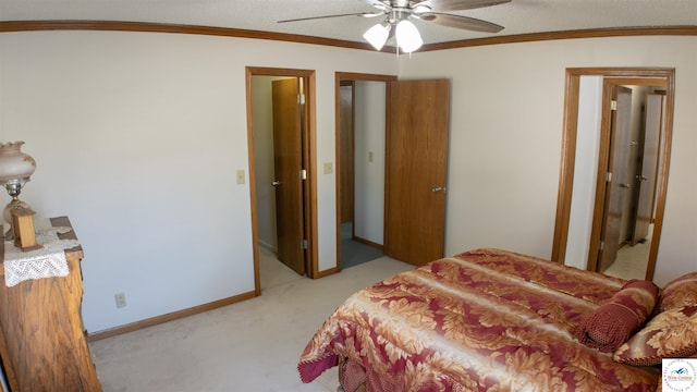 bedroom with light colored carpet, crown molding, a ceiling fan, and baseboards