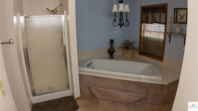 bathroom with a stall shower and a bath