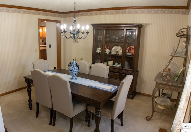 dining room with light colored carpet, a chandelier, wallpapered walls, and baseboards