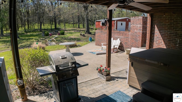 view of patio / terrace with ceiling fan and grilling area