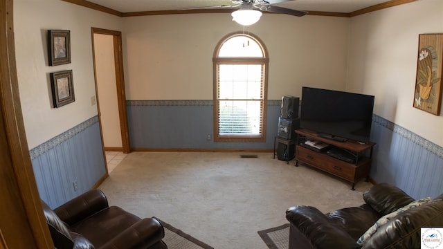 1679 Sunchase Dr, Warsaw, MO 65355 - carpeted living area featuring a ceiling fan, ornamental molding, plenty of natural light, and a wainscoted wall
