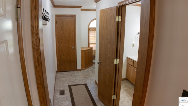 1679 Sunchase Dr, Warsaw, MO 65355 - hallway featuring light carpet, visible vents, and crown molding