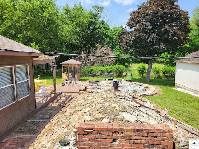 81 SE 500th Rd, Clinton, MO 64735 - view of patio with an outdoor fire pit, a wooden deck, and a gazebo
