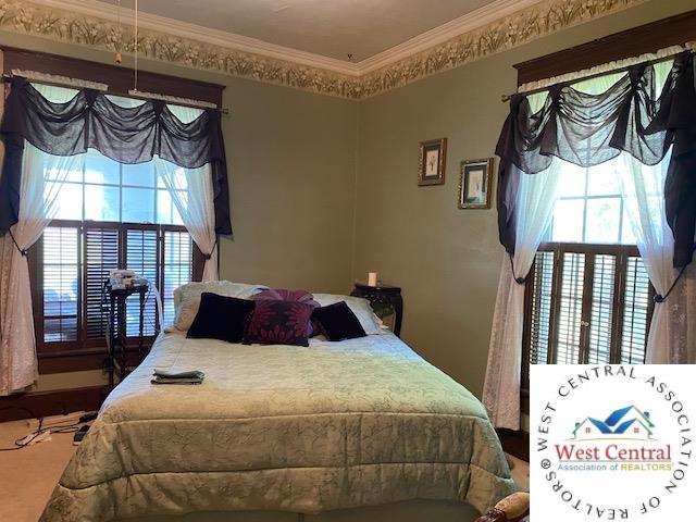 81 SE 500th Rd, Clinton, MO 64735 - bedroom featuring multiple windows and crown molding