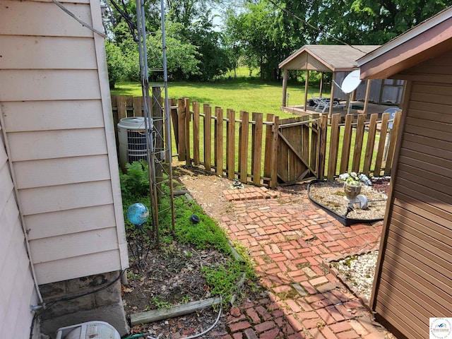 81 SE 500th Rd, Clinton, MO 64735 - view of yard featuring a gate and central AC