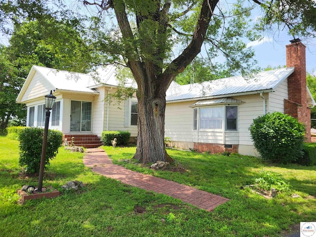 81 SE 500th Rd, Clinton, MO 64735 - view of front of property featuring a front lawn, a chimney, and metal roof