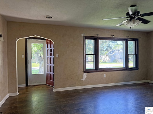 109 E Fairview St, Clinton, MO 64735 - entrance foyer featuring dark wood-style floors, a ceiling fan, and a textured ceiling