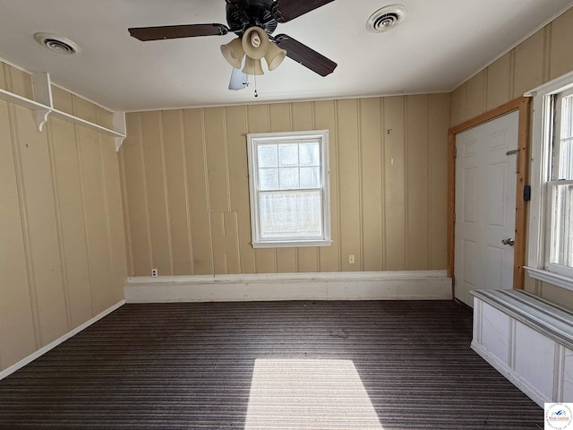 109 E Fairview St, Clinton, MO 64735 - empty room with ceiling fan and dark carpet