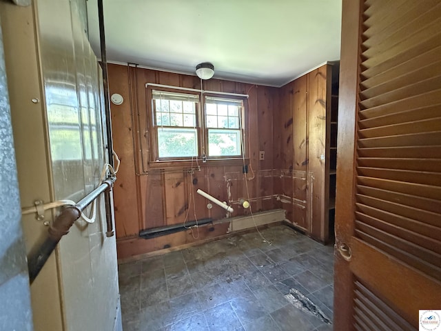 109 E Fairview St, Clinton, MO 64735 - entryway with wooden walls and dark stone finish flooring