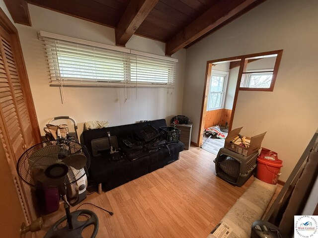 31450 Stonecrest Rd, Warsaw, MO 65355 - living room featuring wood ceiling, vaulted ceiling with beams, wood finished floors, and plenty of natural light
