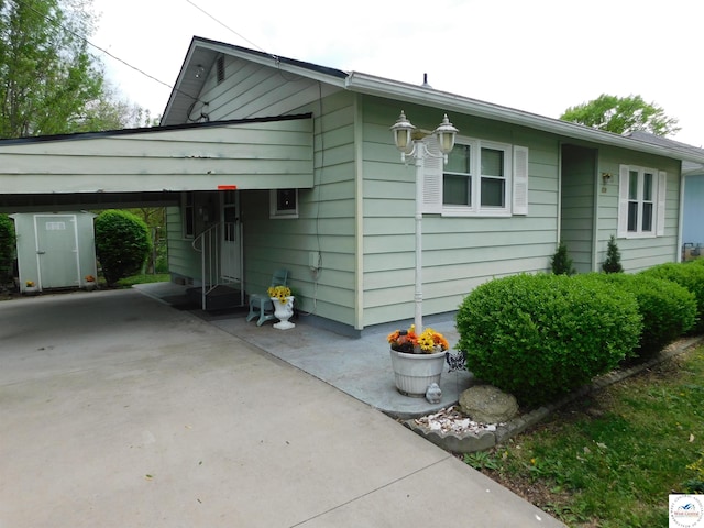 view of front of home with a carport