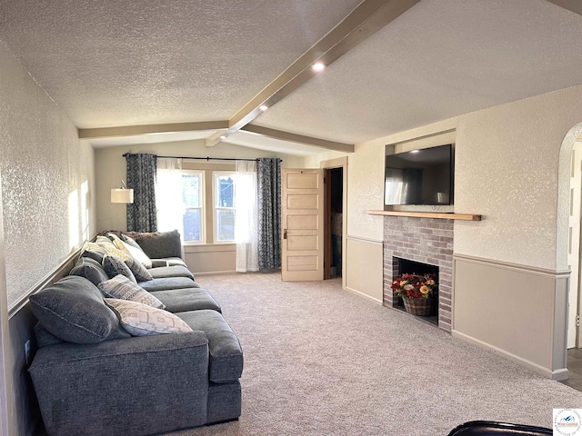 403 Van Buren St, Warsaw, MO 65355 - living room featuring a fireplace, lofted ceiling with beams, a textured wall, baseboards, and a textured ceiling