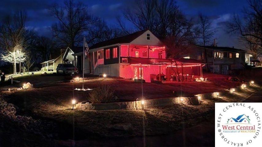 view of back of house at twilight