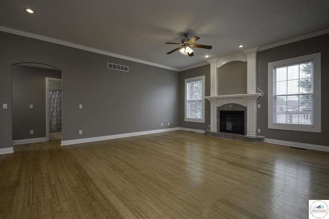 3415 Callaway Dr, Sedalia, MO 65301 - unfurnished living room with a ceiling fan, healthy amount of natural light, wood finished floors, crown molding, and baseboards
