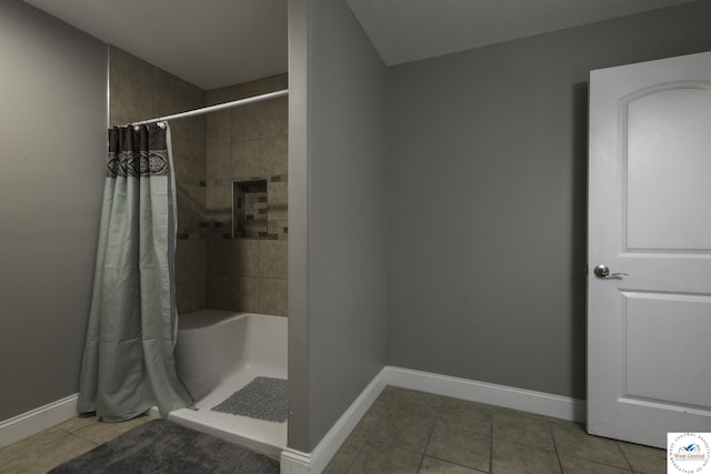 3415 Callaway Dr, Sedalia, MO 65301 - full bath featuring tile patterned flooring, a shower with shower curtain, and baseboards