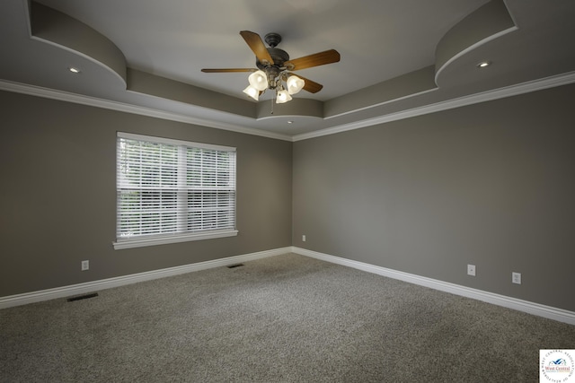 3415 Callaway Dr, Sedalia, MO 65301 - spare room with a raised ceiling, carpet, ceiling fan, ornamental molding, and baseboards