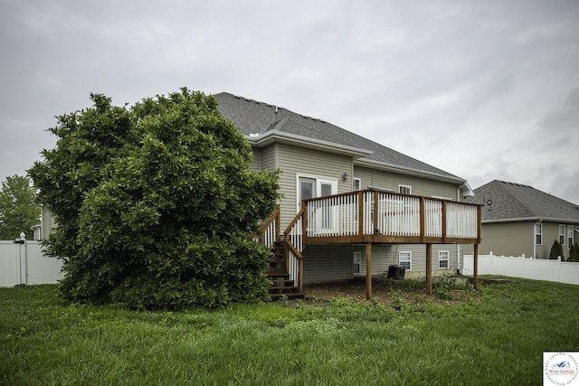 3415 Callaway Dr, Sedalia, MO 65301 - back of house with a wooden deck, a shingled roof, and stairs