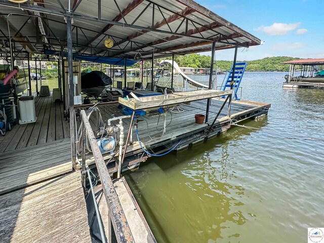 15157 Bass Rd, Gravois Mills, MO 65037 - dock area featuring boat lift and a water view