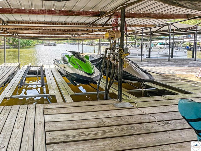 15157 Bass Rd, Gravois Mills, MO 65037 - dock featuring boat lift and a water view