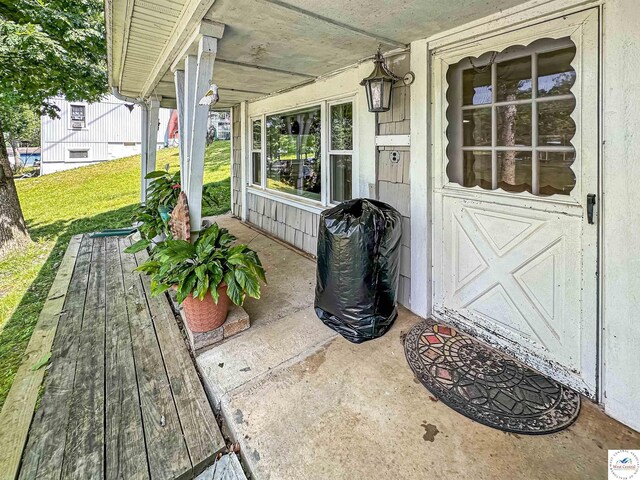 15157 Bass Rd, Gravois Mills, MO 65037 - porch featuring a yard and area for grilling