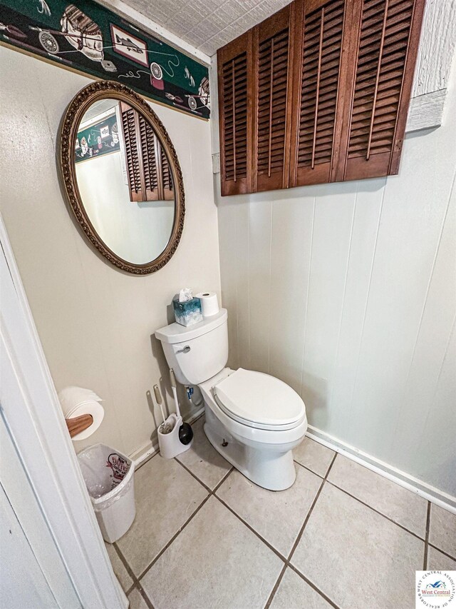 15157 Bass Rd, Gravois Mills, MO 65037 - half bathroom with toilet and tile patterned floors