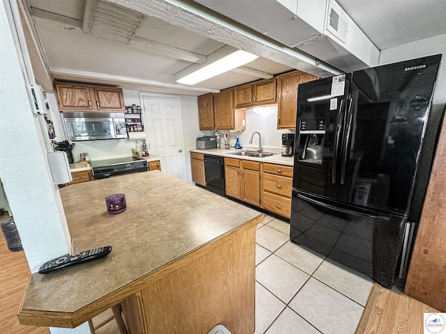 15157 Bass Rd, Gravois Mills, MO 65037 - kitchen with black appliances, a sink, brown cabinets, light tile patterned floors, and light countertops