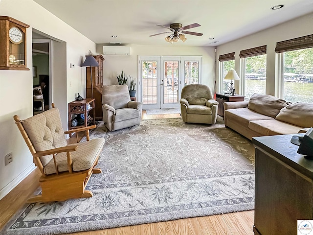15157 Bass Rd, Gravois Mills, MO 65037 - living area with a wall mounted air conditioner, wood finished floors, a ceiling fan, baseboards, and recessed lighting