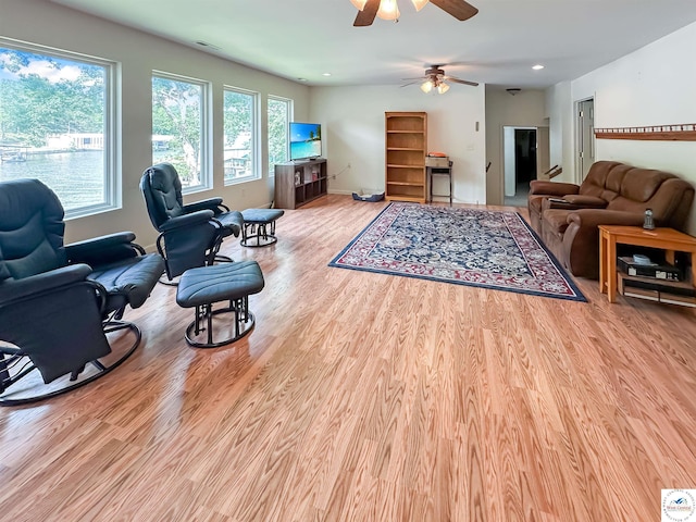 15157 Bass Rd, Gravois Mills, MO 65037 - living area with wood finished floors, a ceiling fan, recessed lighting, and baseboards