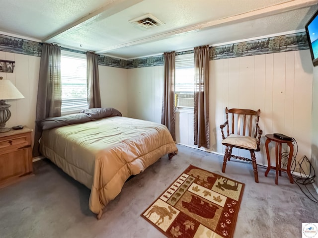 15157 Bass Rd, Gravois Mills, MO 65037 - carpeted bedroom with a textured ceiling and wood walls
