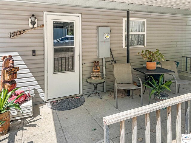 15157 Bass Rd, Gravois Mills, MO 65037 - view of exterior entry with a patio