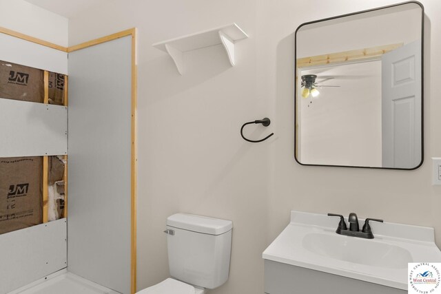 Gardiner Rd, Edwards, MO 65326 - bathroom with ceiling fan, toilet, and vanity