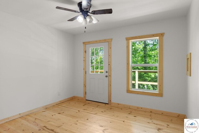Gardiner Rd, Edwards, MO 65326 - entryway featuring wood finished floors, a ceiling fan, and baseboards