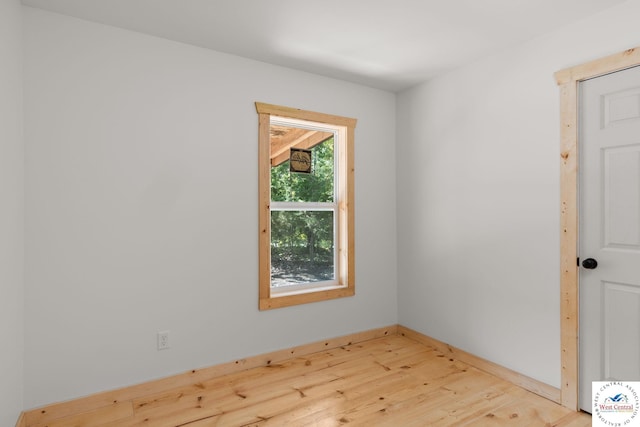 Gardiner Rd, Edwards, MO 65326 - unfurnished room featuring wood finished floors and baseboards