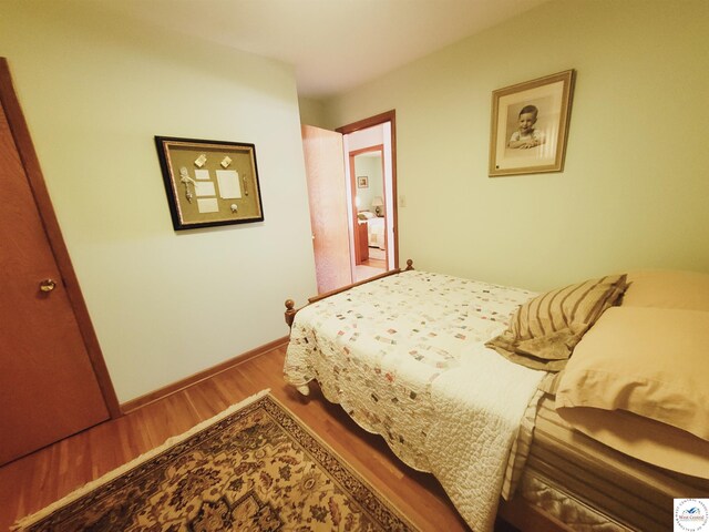 330 W State St, Tipton, MO 65081 - bedroom featuring baseboards and wood finished floors