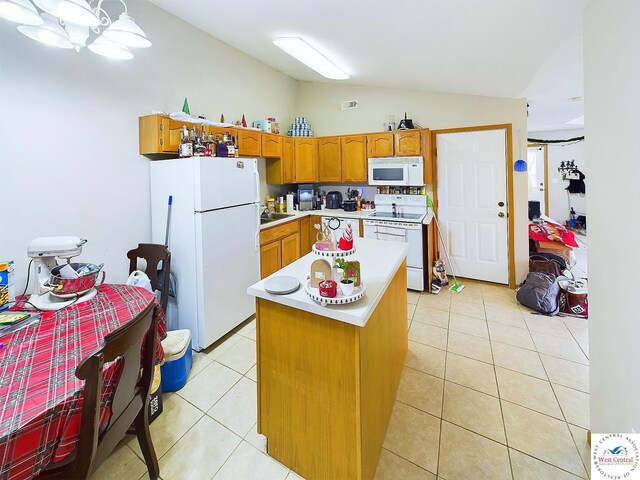 113 SE 1171st Rd, Knob Noster, MO 65336 - kitchen featuring white appliances, vaulted ceiling, light countertops, light tile patterned floors, and brown cabinets