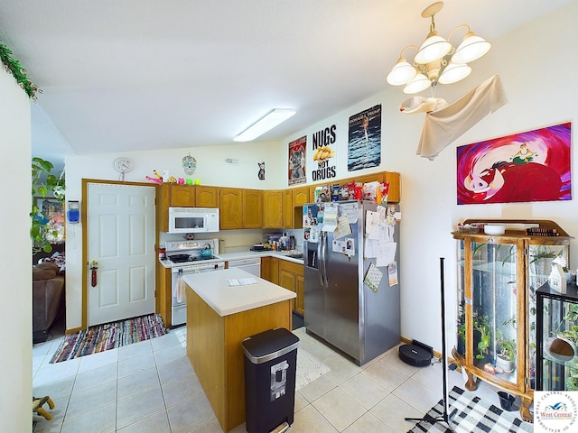 113 SE 1171st Rd, Knob Noster, MO 65336 - kitchen featuring white appliances, light countertops, vaulted ceiling, a kitchen island, and brown cabinetry