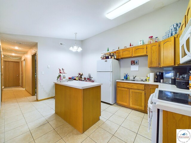 113 SE 1171st Rd, Knob Noster, MO 65336 - kitchen featuring white appliances, a sink, light tile patterned floors, and a kitchen island