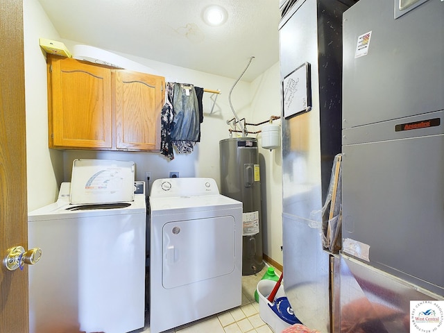 113 SE 1171st Rd, Knob Noster, MO 65336 - laundry area featuring water heater, cabinet space, washer and clothes dryer, and heating unit