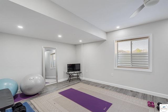 workout area with recessed lighting, baseboards, ceiling fan, and wood finished floors