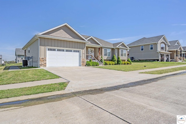 view of front of home featuring an attached garage, a front lawn, stone siding, board and batten siding, and concrete driveway