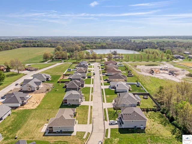drone / aerial view with a residential view and a water view